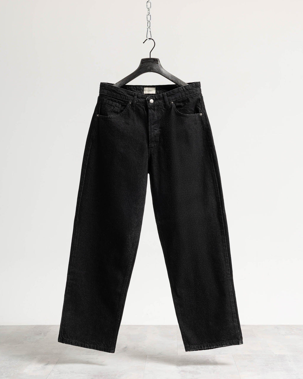 Jeans baggy nero resinato